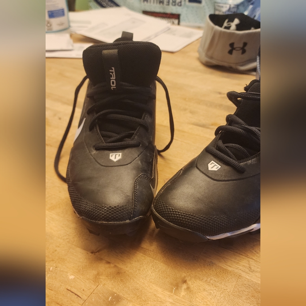 Black Nike Cleats with White Swoosh